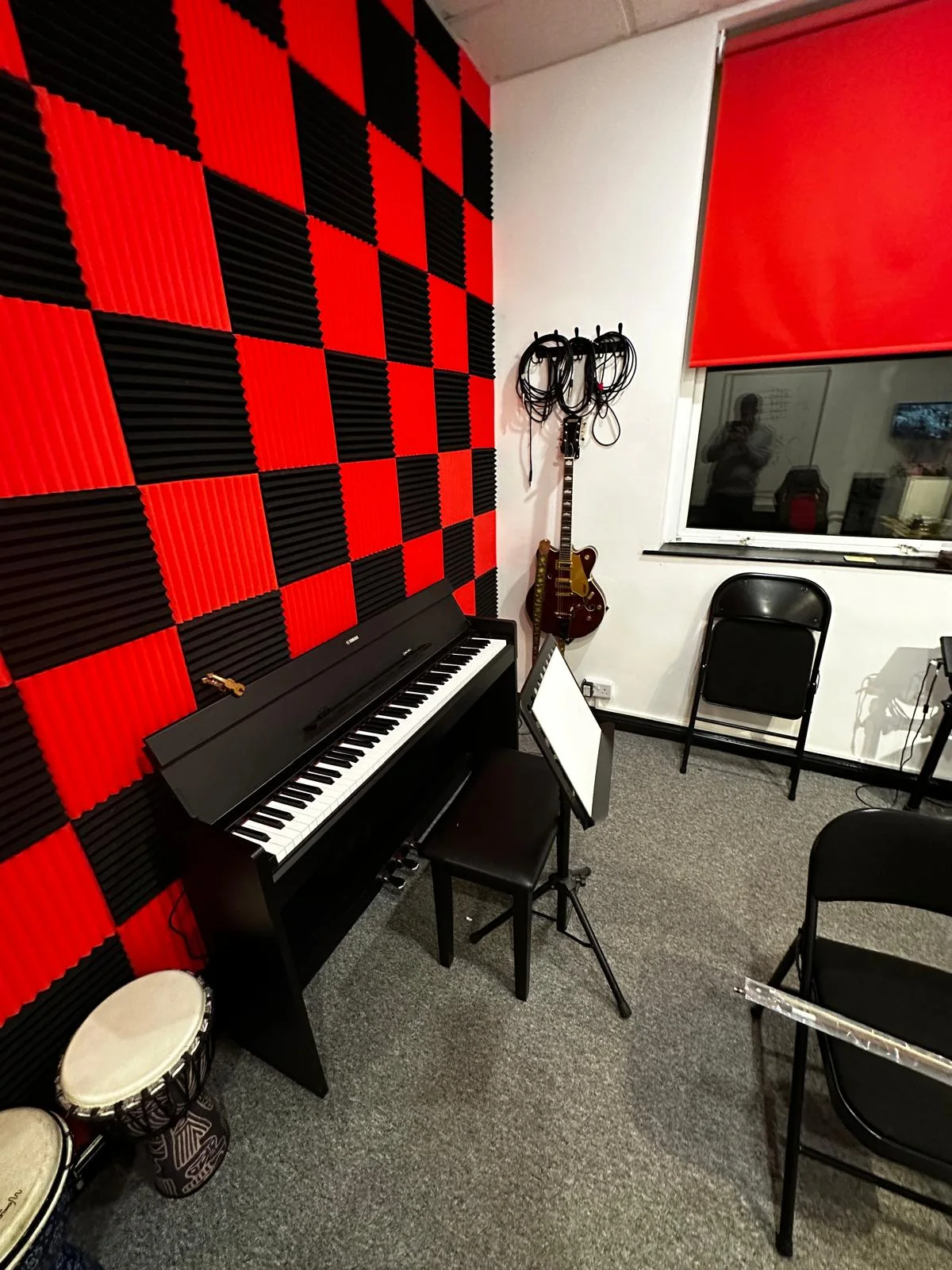Soundproof teaching room at Elegance Music Tuition with piano and instruments