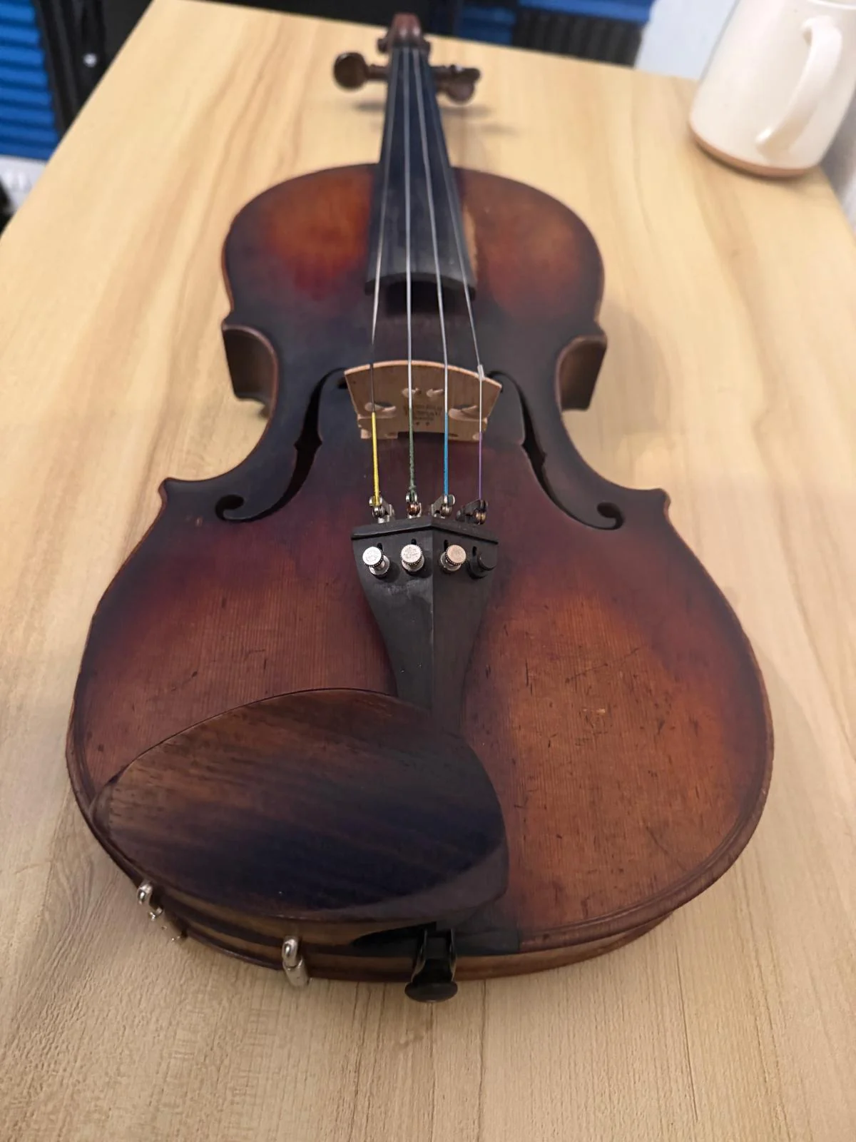 Violin before a full service with a duller finish