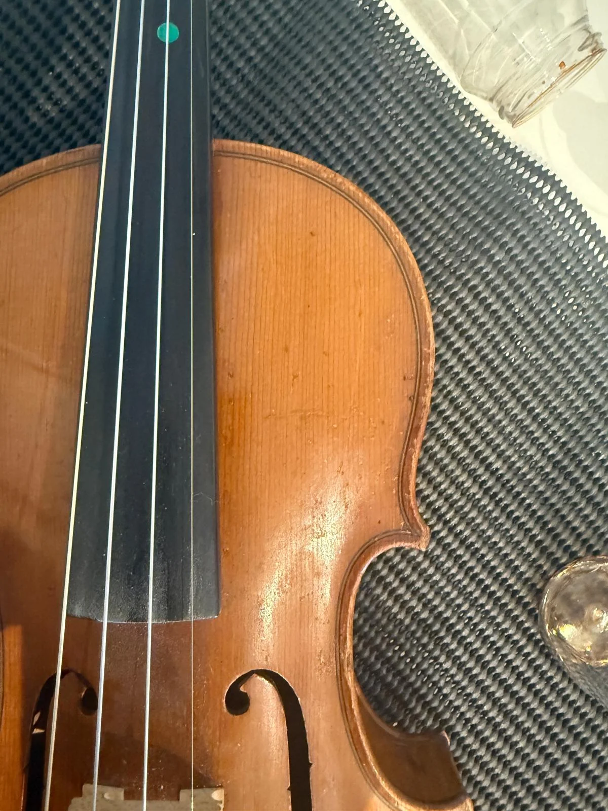 Violin after varnish repair with a cleaner and more even finish