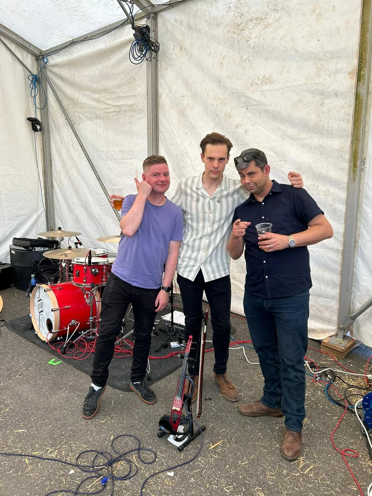 Backstage with musicians and performance equipment