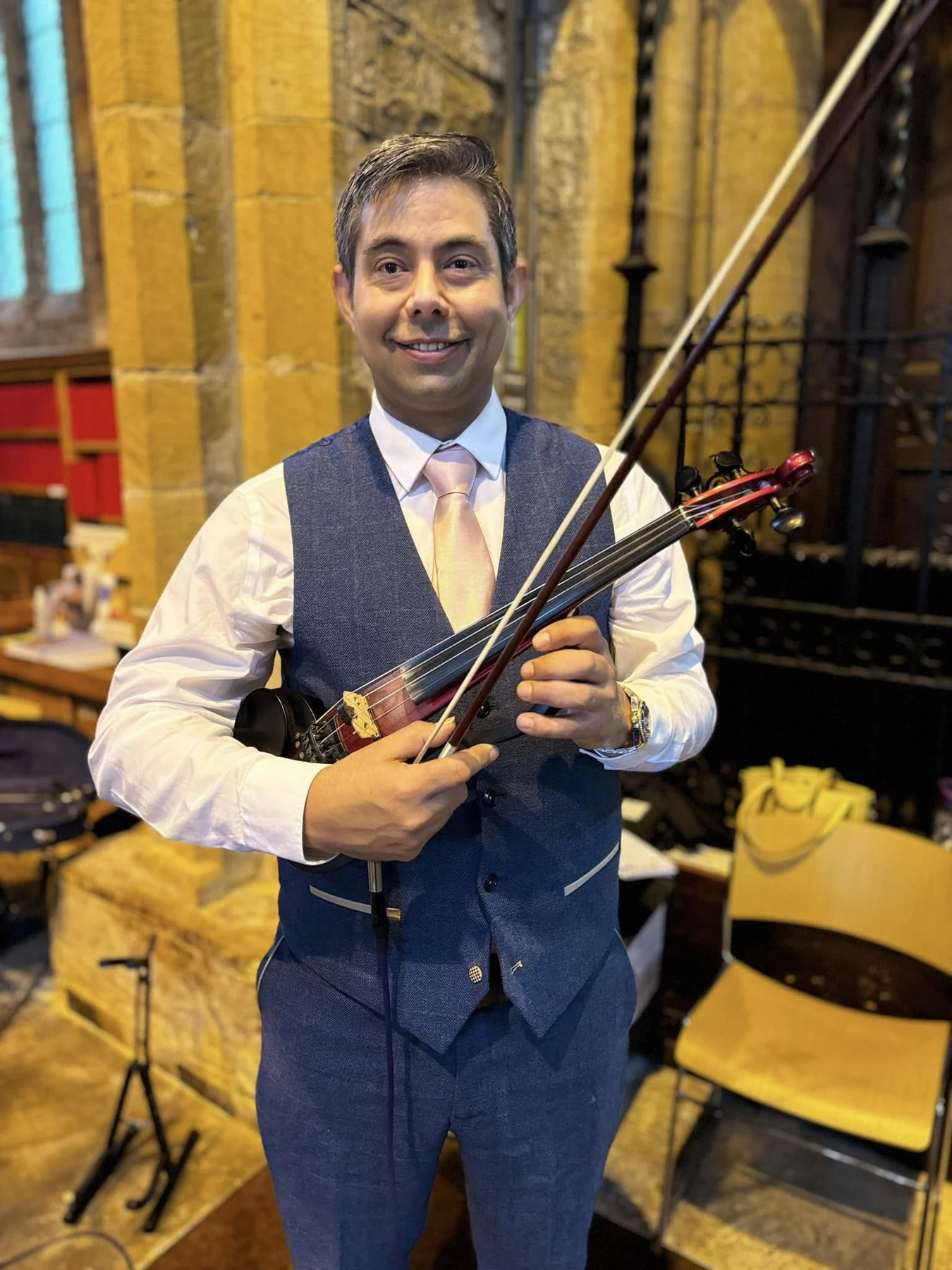 James Taylor performing electric violin at a wedding ceremony